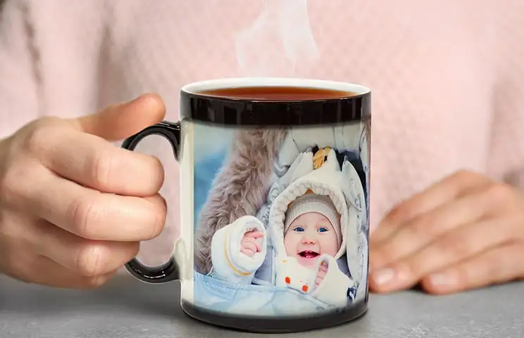 Personalised magic mug; steaming hot drink reveals adorable baby photo. Unique gift!