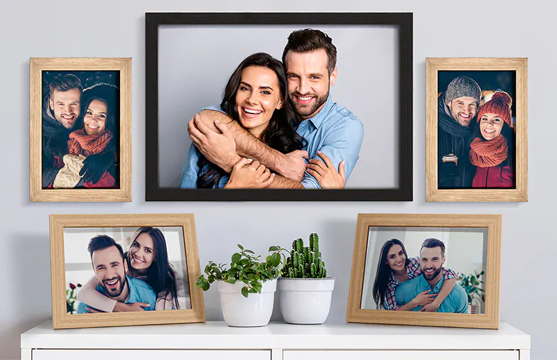 Personalised photo frames: Couple's portraits in various styles, creating a loving home display.